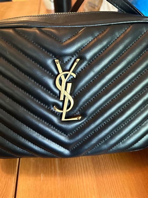 YSL logo extremely scratched .